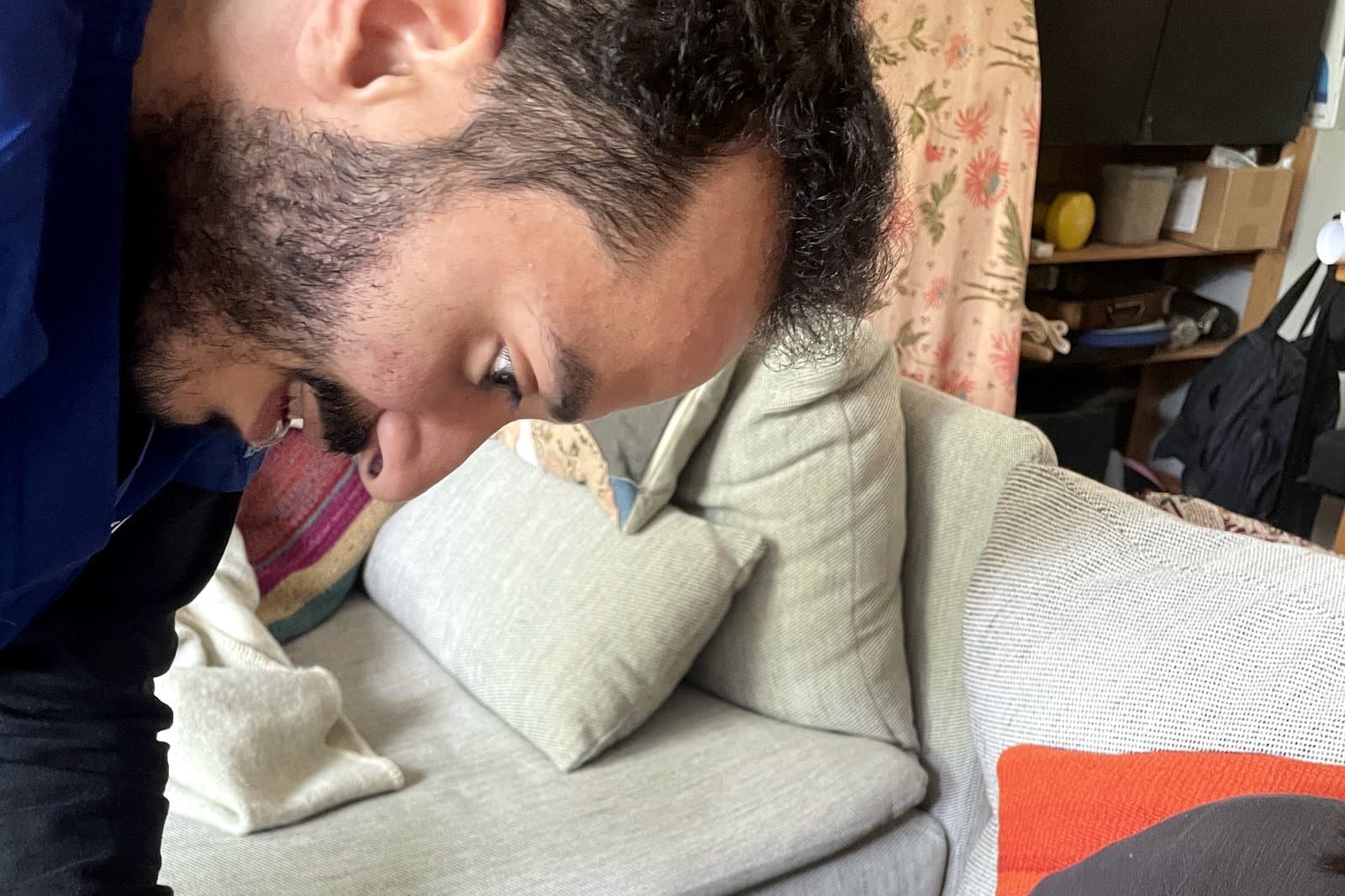 Ziad focused mid-examination during a home visit